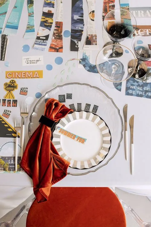 Table setting with orange accents at rectangular table