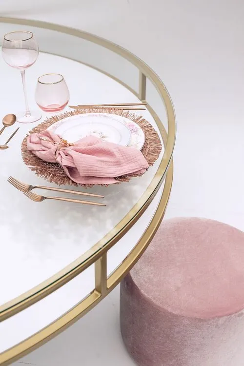 Table setting with pink accents at round table