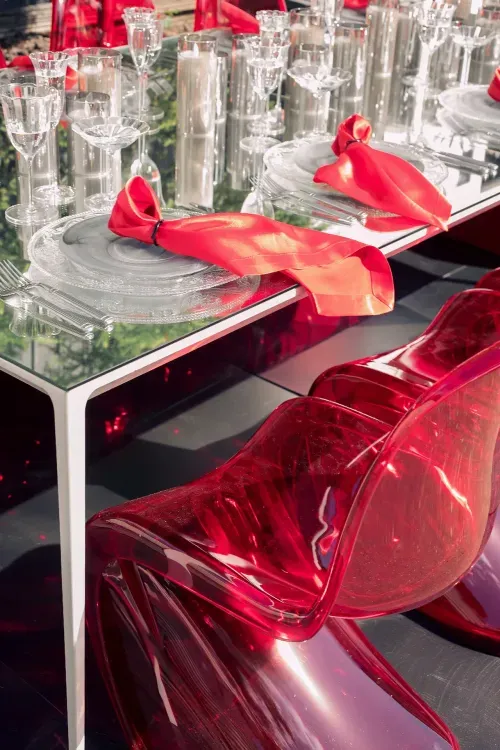 Translucent set with red accents on a white rectangular table