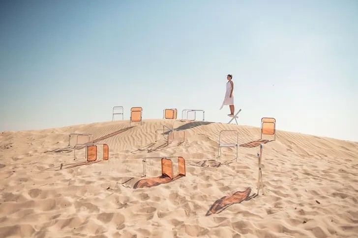 Transparent folding chairs desert