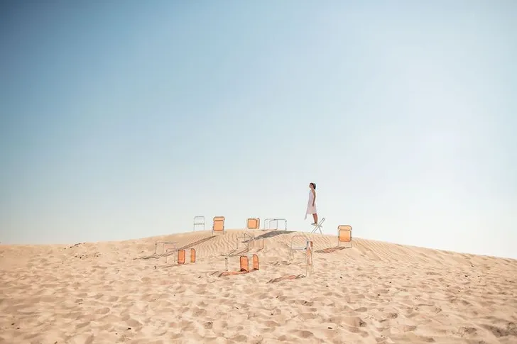 Transparent folding chairs desert
