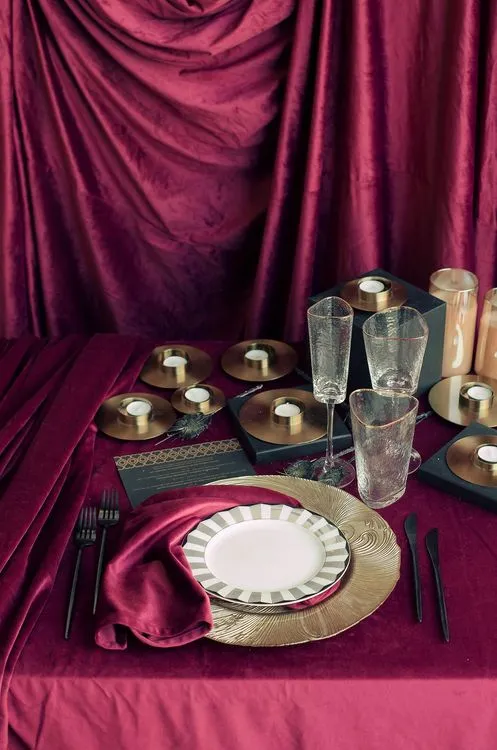 Velvet-Draped Dining — Gold Candles, Burgundy Noir