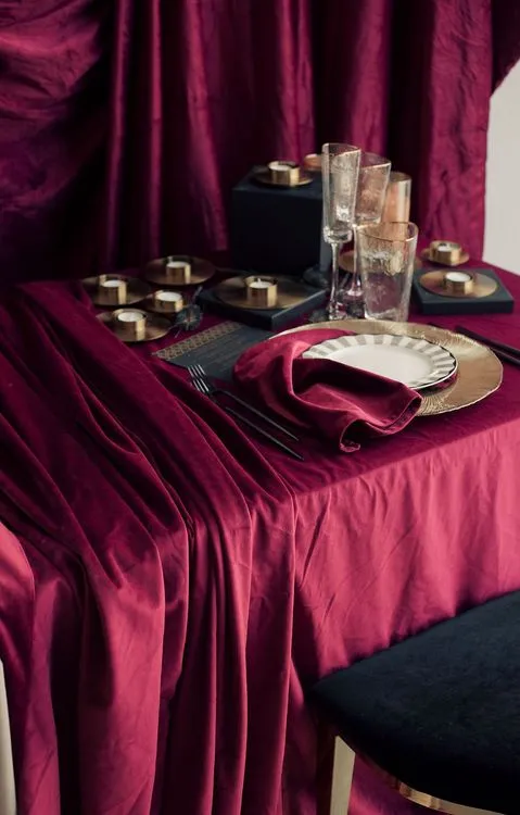 Velvet-Draped Dining — Gold Candles, Burgundy Noir