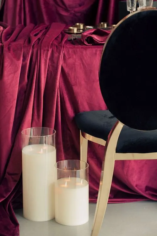 Velvet-Draped Dining — Gold Candles, Burgundy Noir