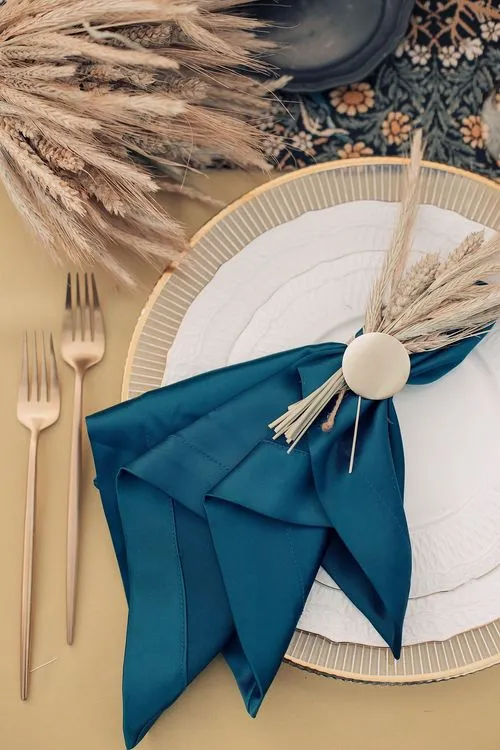 Wheat table setting with blue accent