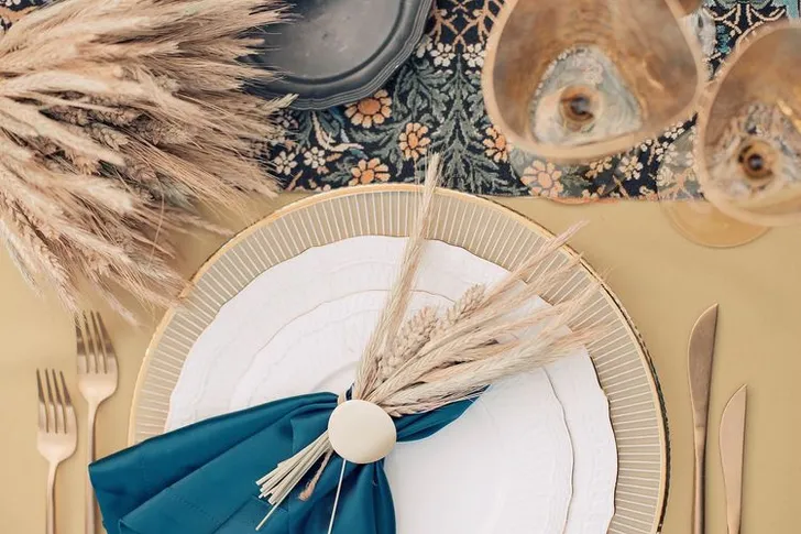 Wheat table setting with blue accent