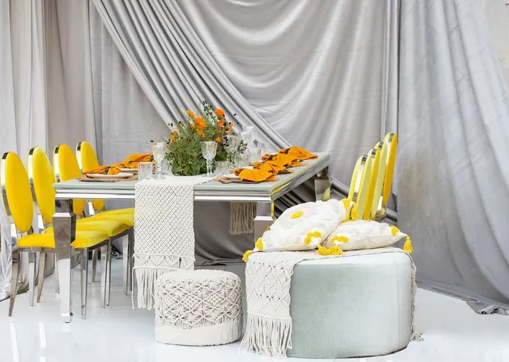 Yellow-orange table setting at rectangular table