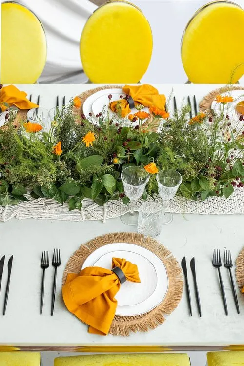 Yellow-orange table setting at rectangular table