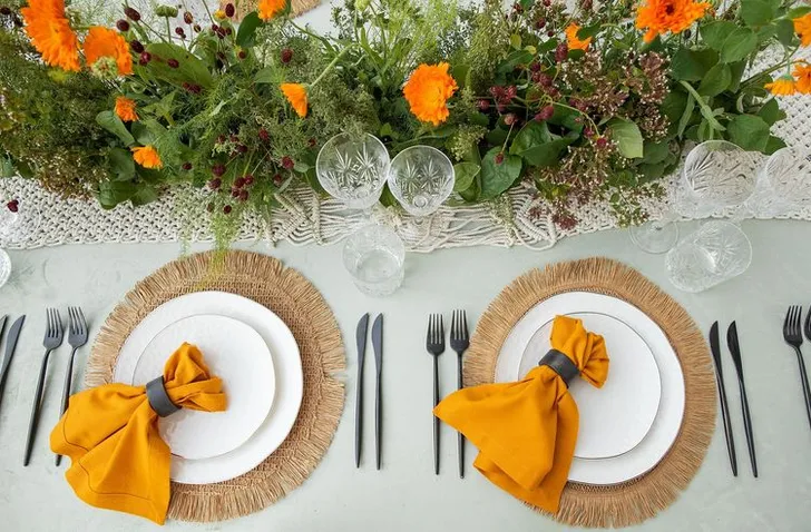 Yellow-orange table setting at rectangular table