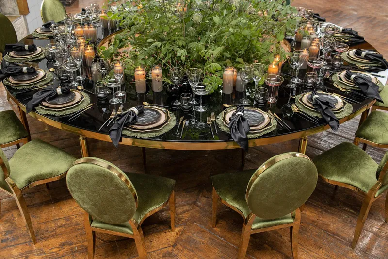 Green serving at serpentine table