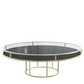 Gold round CORNELL KIDS table with black plastic shelf and clear glass top